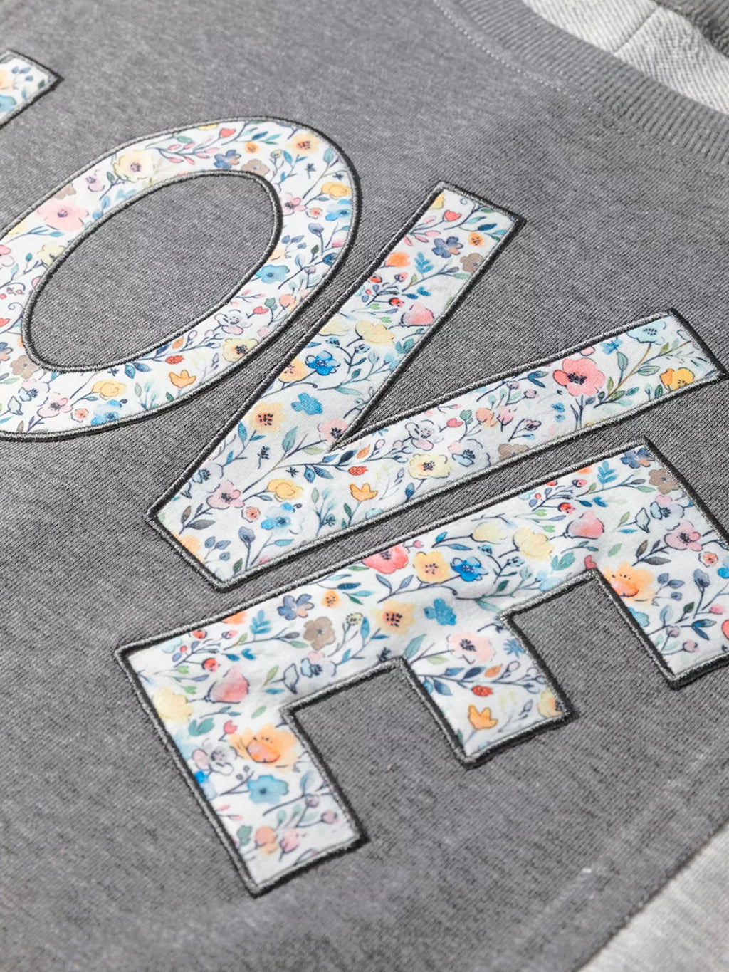 LOVE Graphic Exposed Seam Patchwork Uneven Hem Chic Sweatshirt