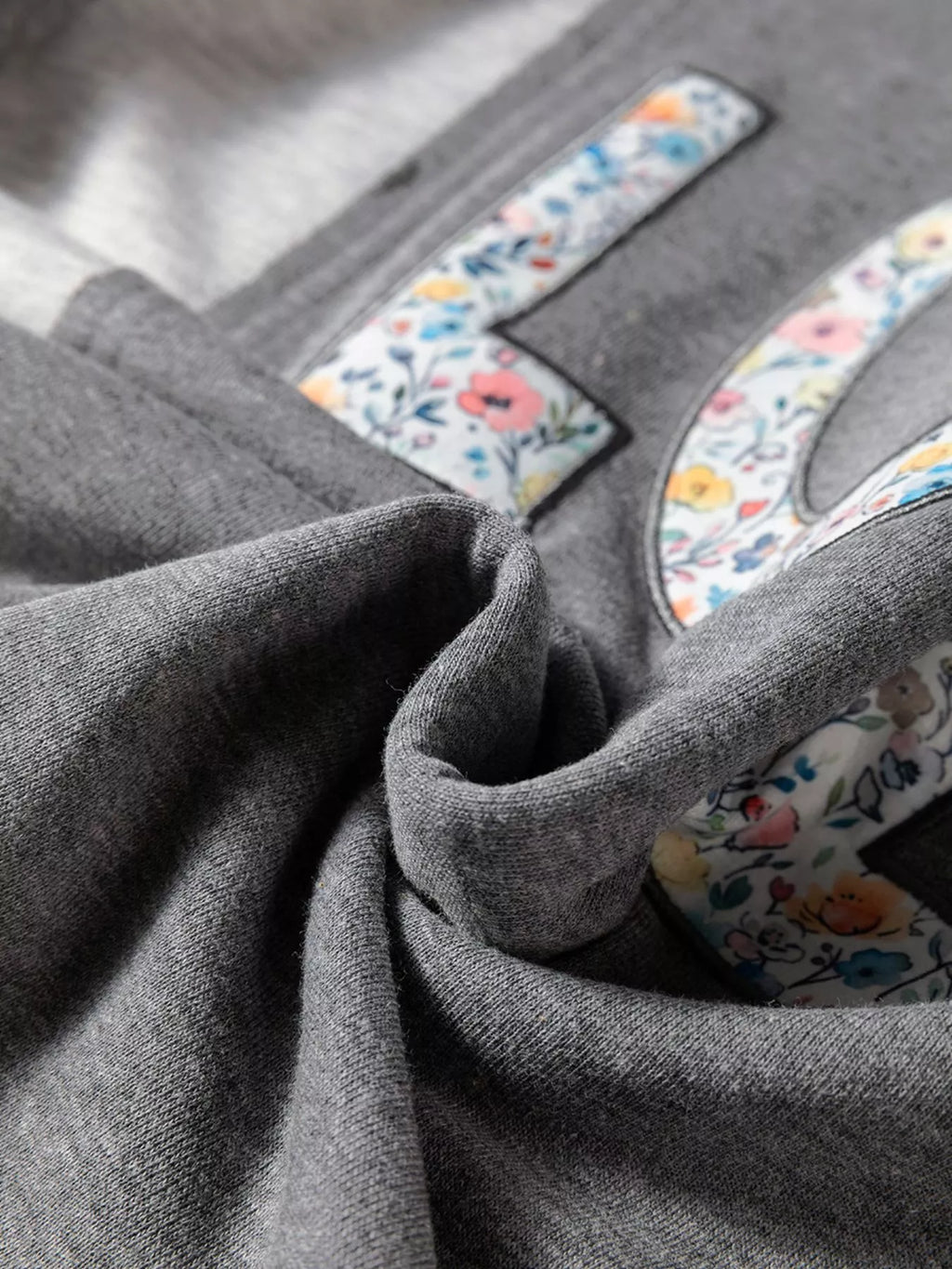 LOVE Graphic Exposed Seam Patchwork Uneven Hem Chic Sweatshirt